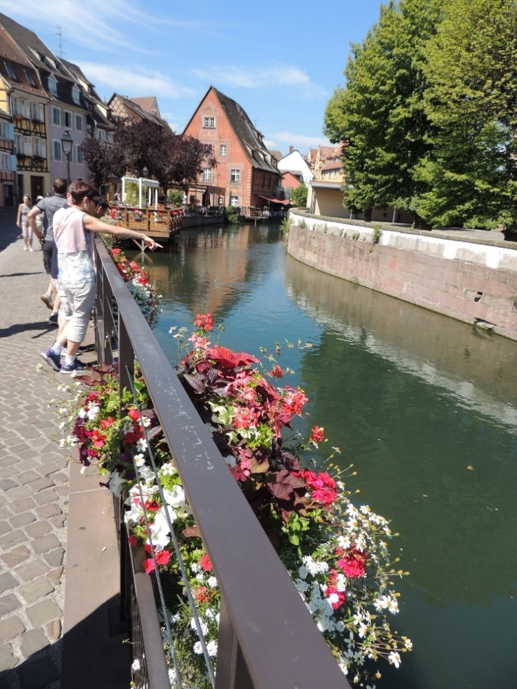 France Genealogy by popular US online genealogists, Price Genealogy: image of a canal in a French town.