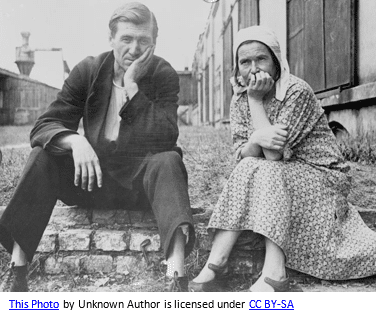 German genealogy by popular US online genealogists, Price Genealogy: black and white image of a man and woman sitting next to each other outside as they rest their chins in their hands.