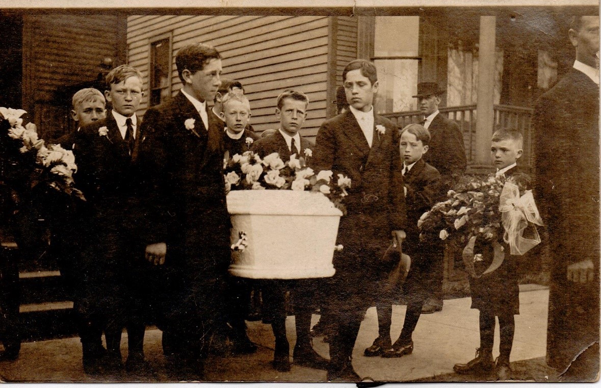 Genealogy Records by popular US online genealogist, Price Genealogy: black and white image of young boys carrying a white casket. 