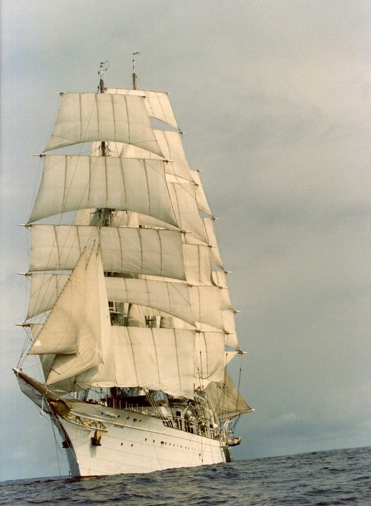 Immigrant Research by popular US online genealogists, Price Genealogy: image of a white ship with white sails on the ocean. 